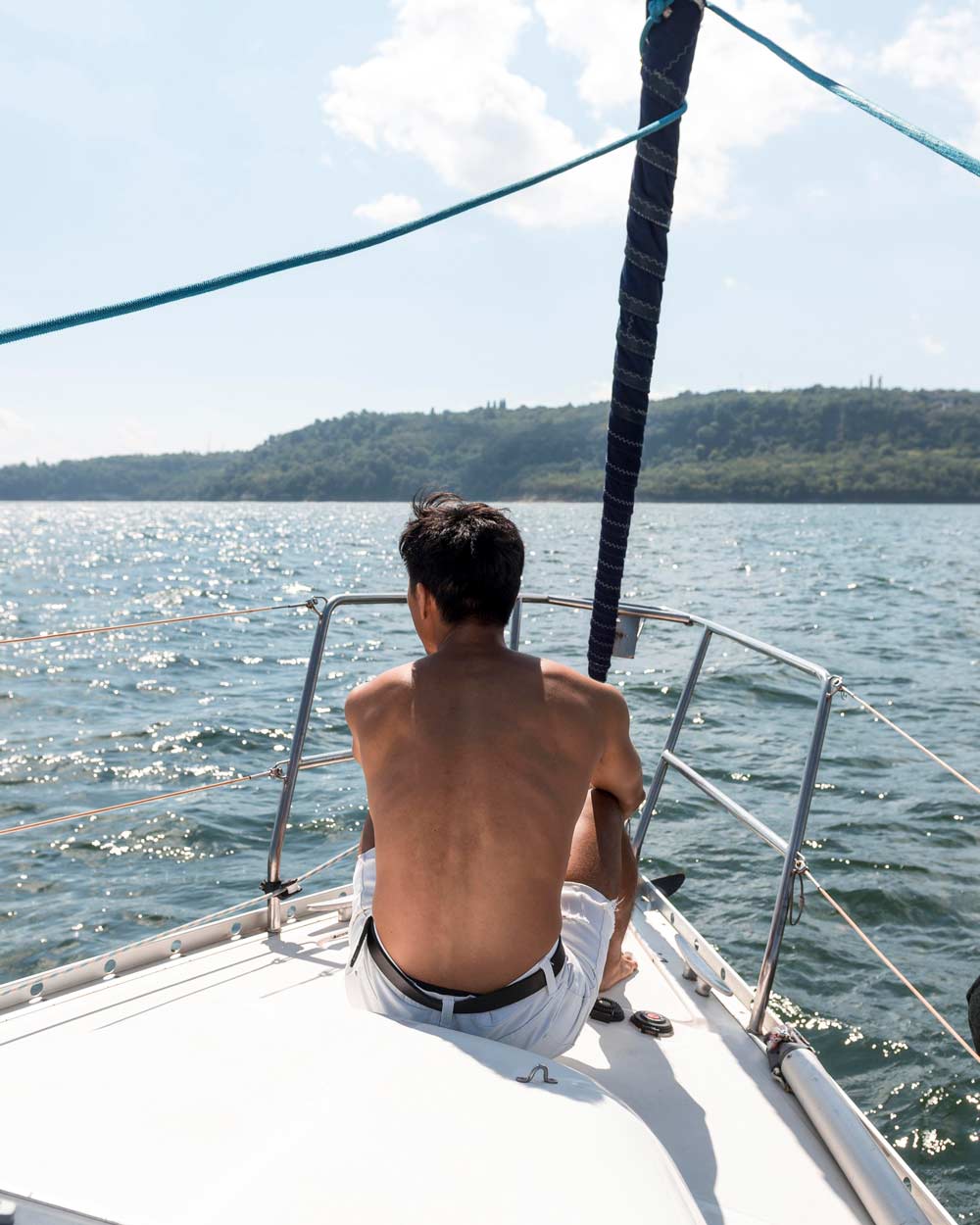 Handsome young man enjoying time on his boat.